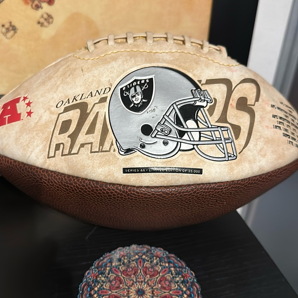 Vintage Oakland Raiders signed football.